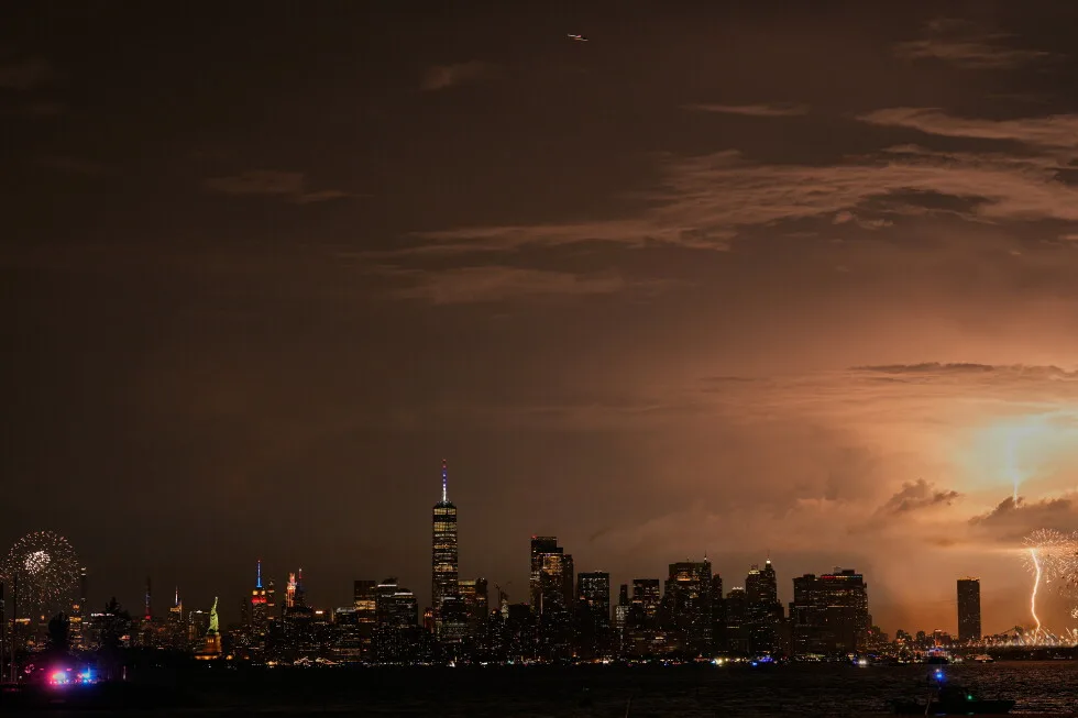A second camera captured lightning over fireworks